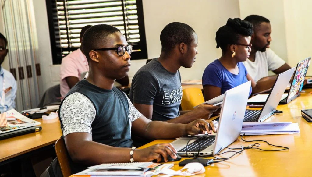 youths studying on computers